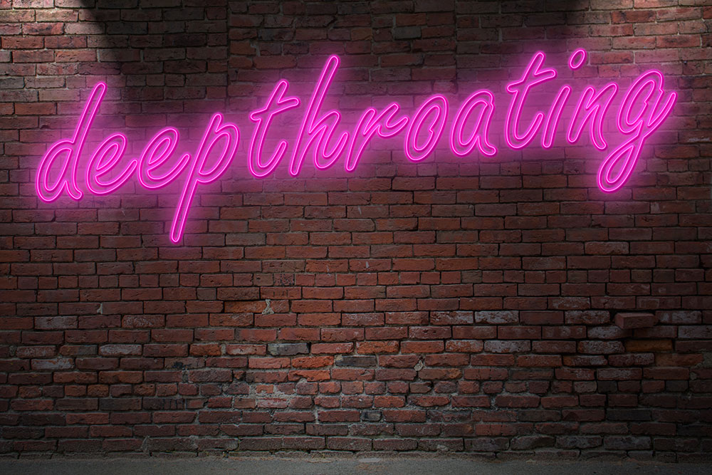 Ziegelmauer mit pinkem Schriftzug deepthoating