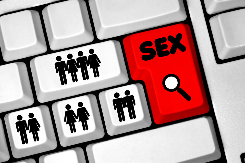 Computertasten mit Paar-Icons und roter Suchtaste